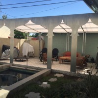 covered patio off of pool