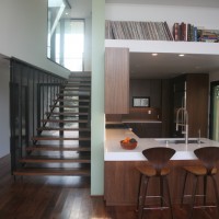 hanging stair with perforated metal creating a screen between front and back of house - photo by Lisa Palmer, Hyperion Art