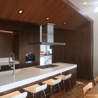 wood ceiling transforms into built-in pantry cabinet